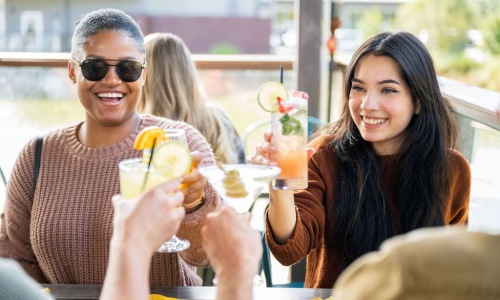 Friends at a table enjoying beverages