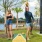 a man and a woman playing corn hole
