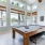 Room with windows and a pool table 