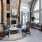 Room with chairs and tables and fireplace