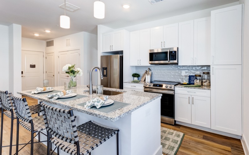 kitchen with island and white cabinets